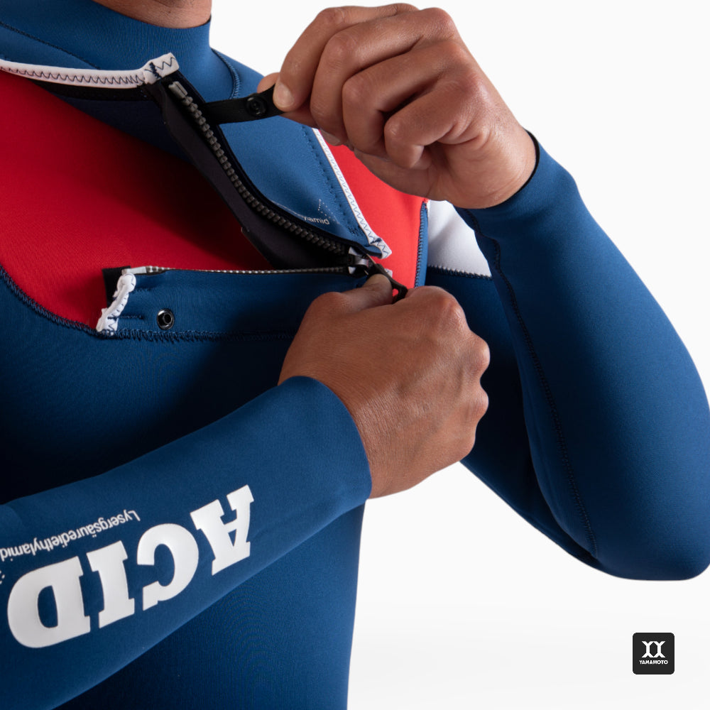 Surfer wearing a navy blue wetsuit JANGA ACID wetsuit - zoom in