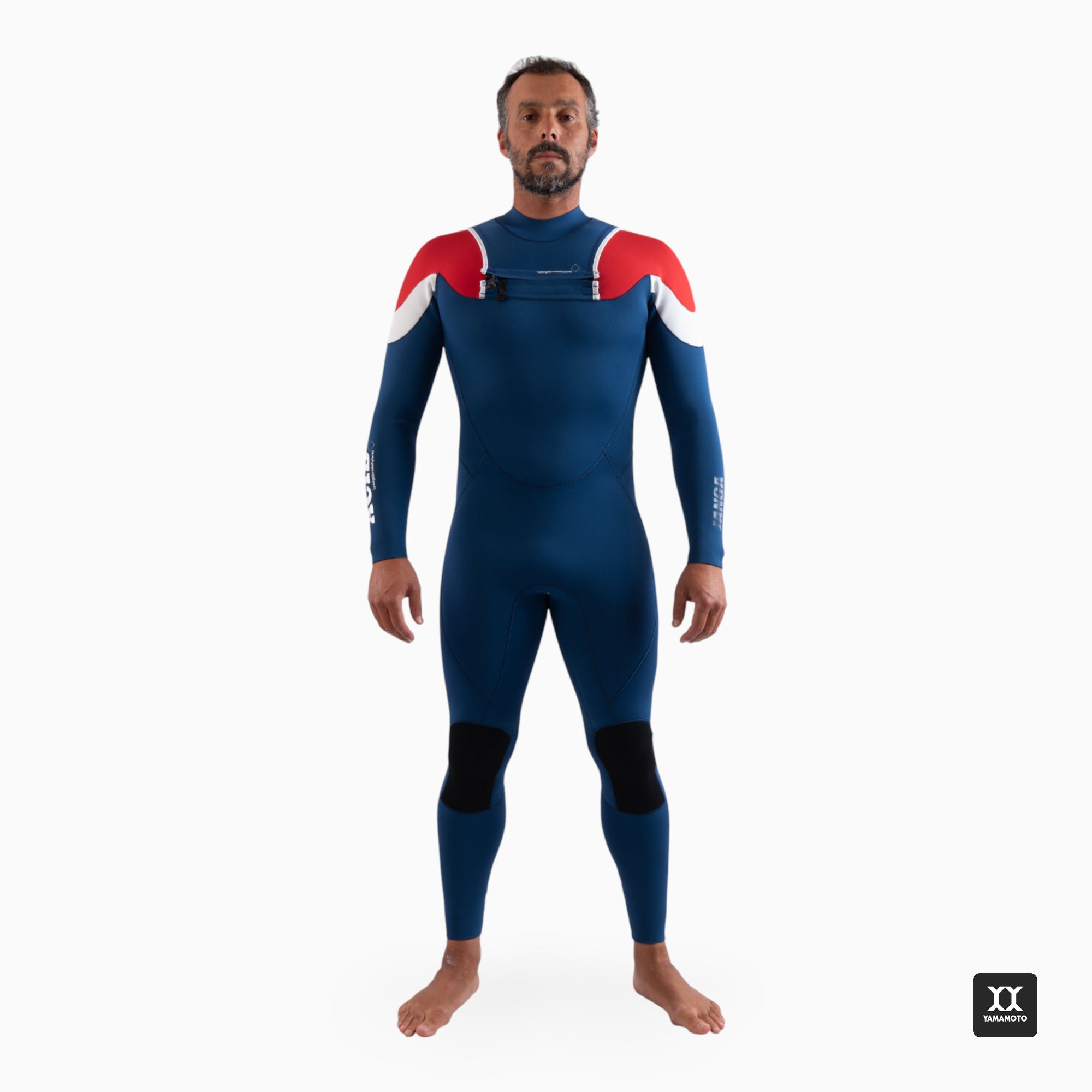 Surfer wearing a navy blue wetsuit JANGA ACID wetsuit front