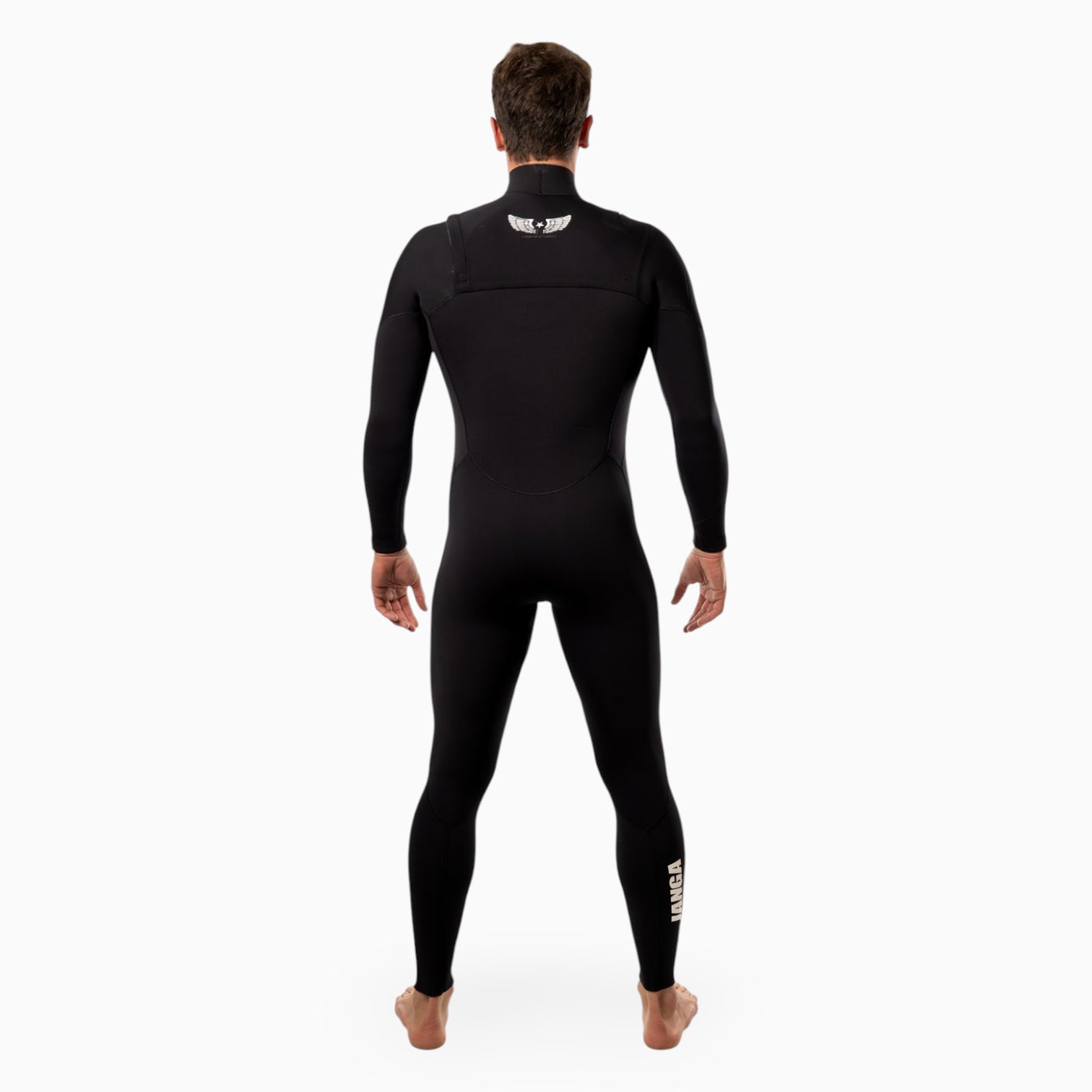 Surfer wearing a JANGA AIRFIGHTER black Yamamoto neoprene wetsuit on a white background