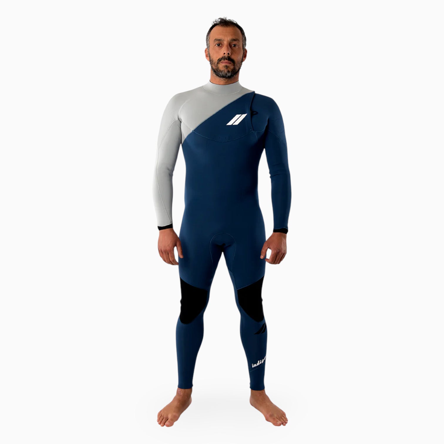 Surfer wearing a JANGA indigent blue and gray wetsuit on a white background