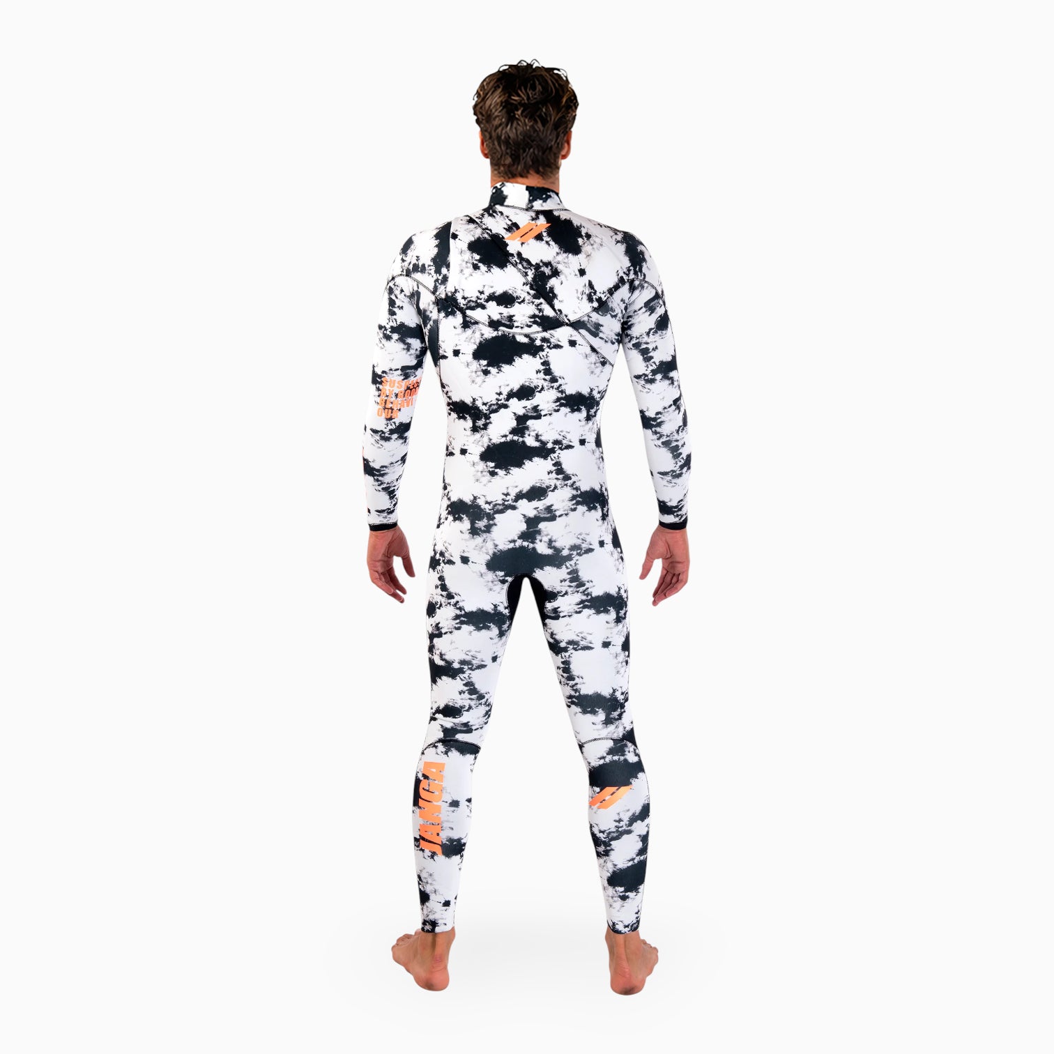 Surfer wearing JANGA INDIGENT white and black camouflage wetsuit with orange accents on a white background