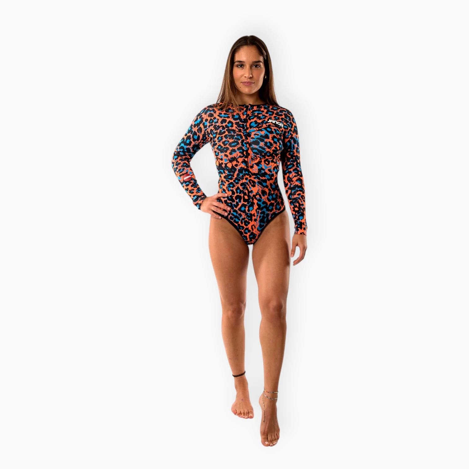 Surfer wearing Women's JANGA JANGLE Orange Leopard short spring wetsuit - front view - zoom on front zip