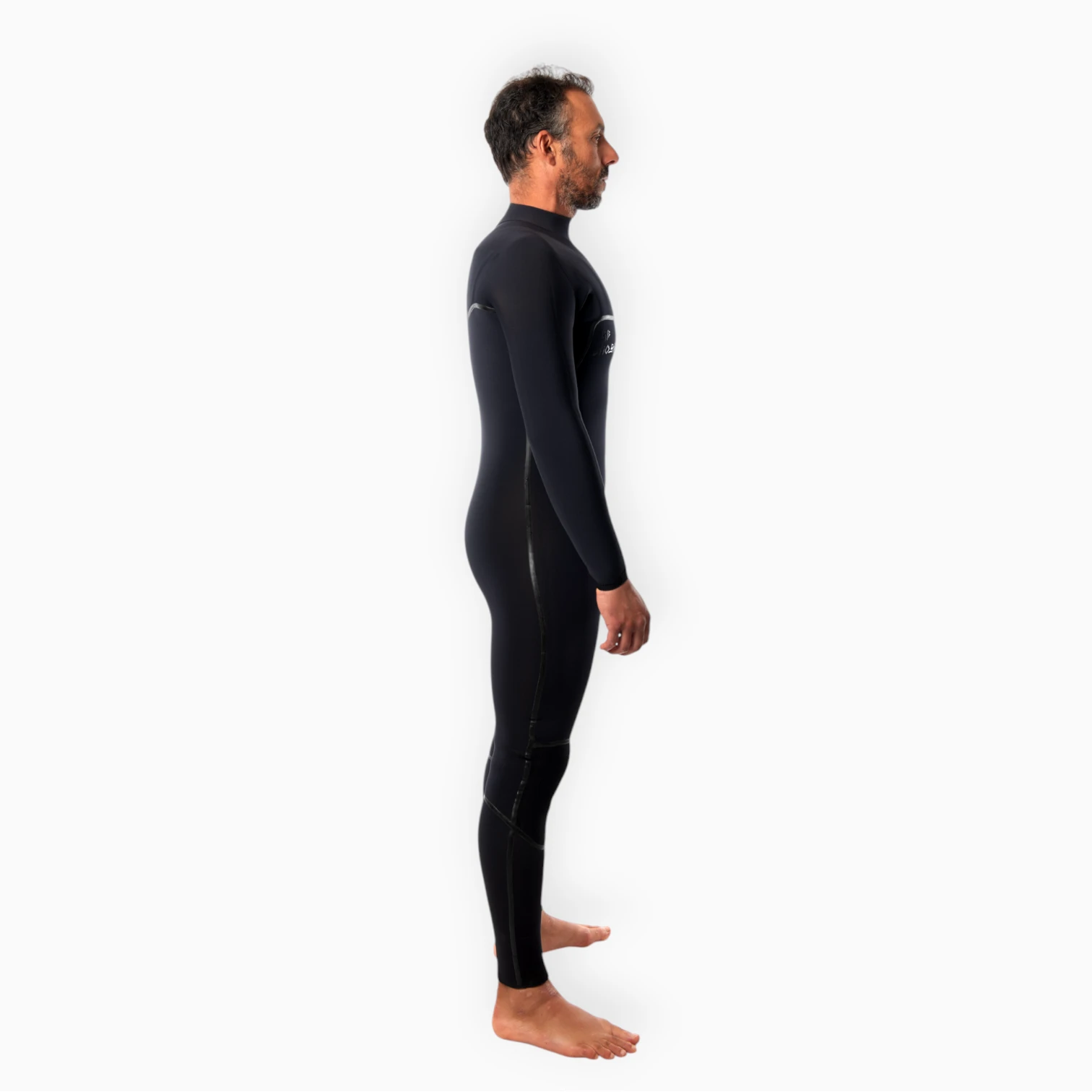 Male surfer wearing JANGA black wetsuit - Chosen Ring of Fire - side view