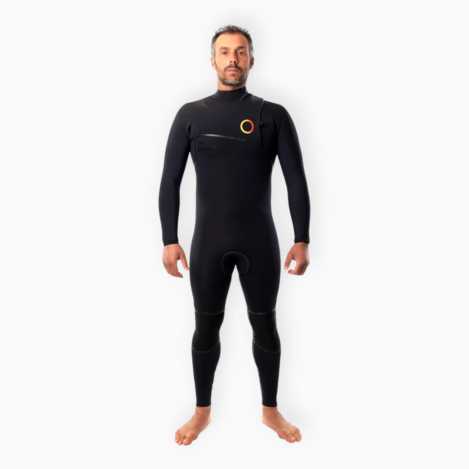 Male surfer wearing JANGA black wetsuit - Chosen Ring of Fire - front view