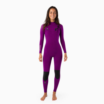 teenage girl surfer in a purple wetsuit 