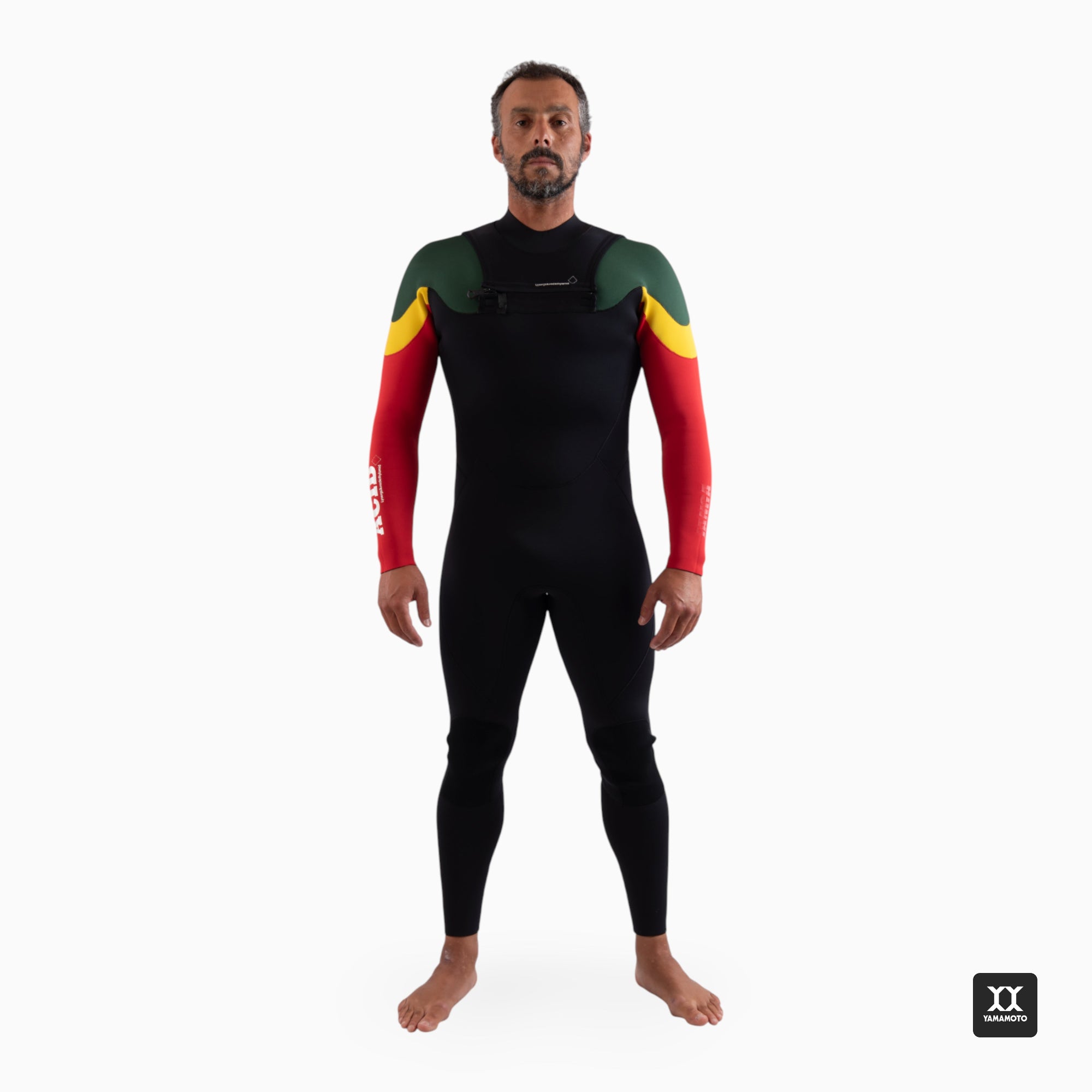 Surfer wearing a black wetsuit with red and yellow sleeves on a white background front