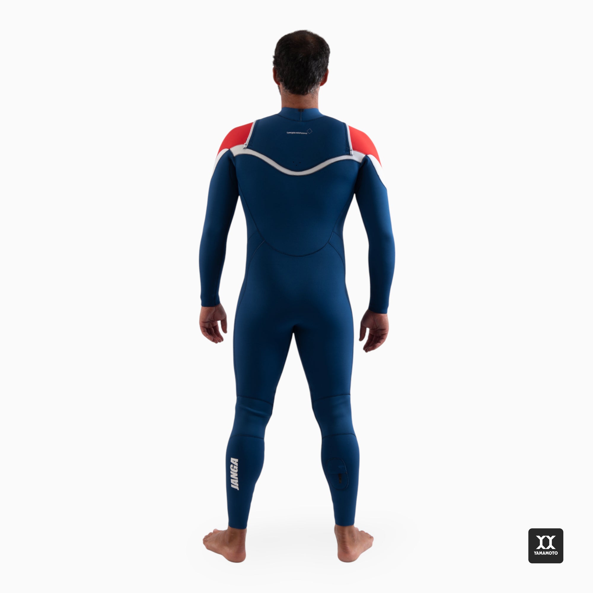 Surfer wearing a navy blue wetsuit JANGA ACID wetsuit 