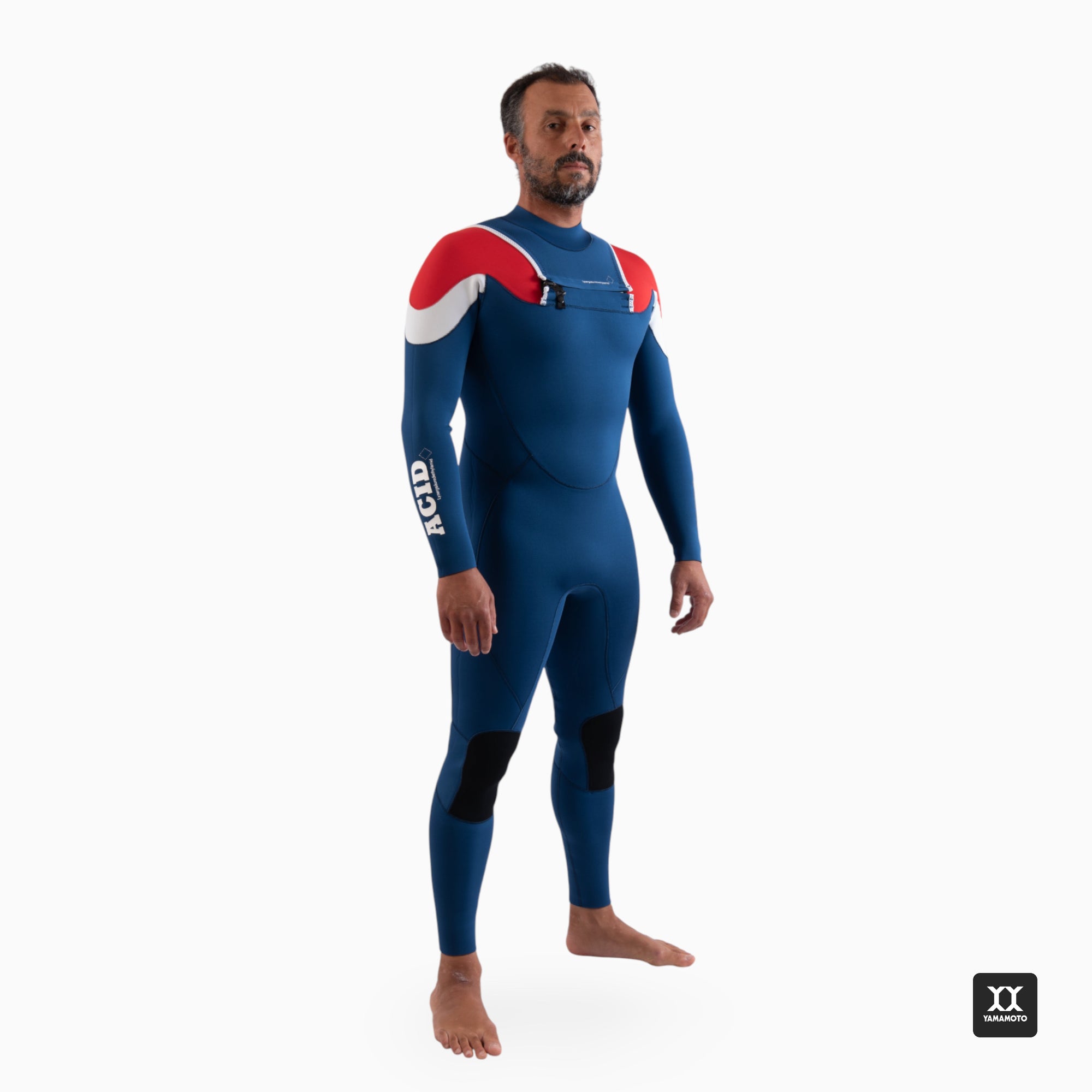 Surfer wearing a navy blue wetsuit JANGA ACID wetsuit 