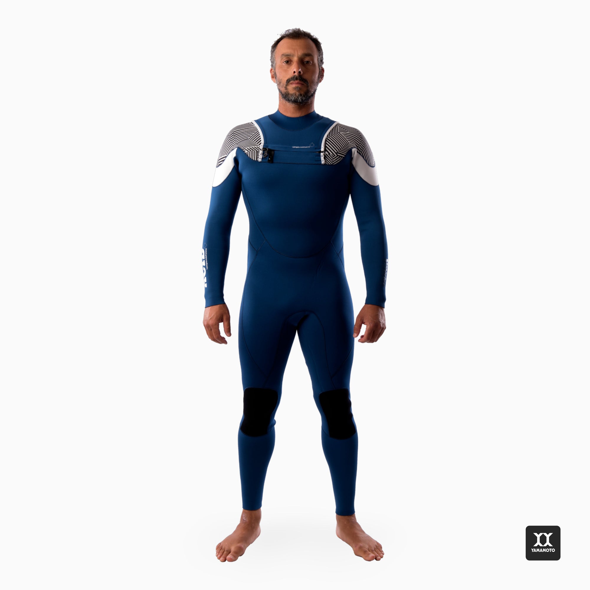 Surfer wearing a JANGA blue wetsuit with white accents on a white background - front