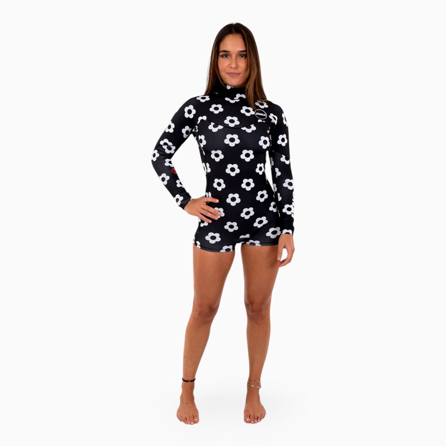 Woman wearing a black and white floral long-sleeve swimsuit on a white background