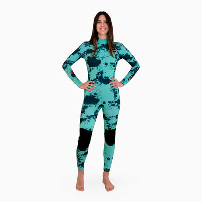 Woman wearing a teal JANGA TIE DYE wetsuit on a white background