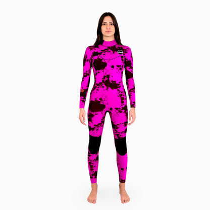 Woman wearing a pink JANGA TIE DYE wetsuit on a white background