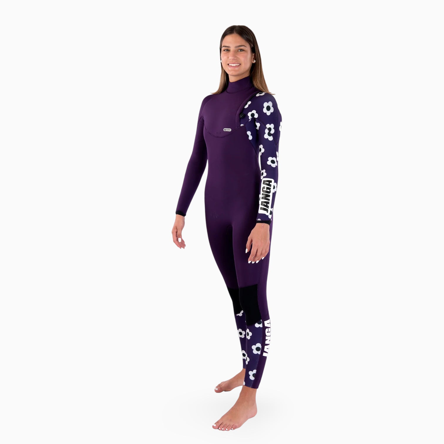 Woman wearing a purple wetsuit with white patterns on a white background
