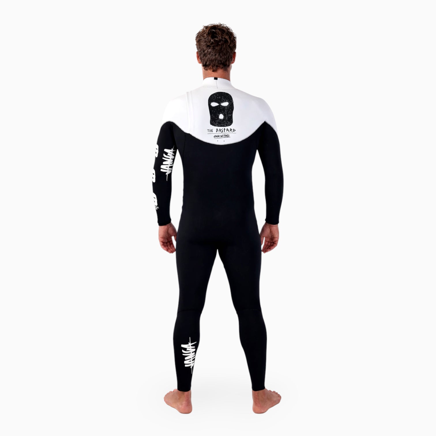 Surfer wearing a JANGA BASTARD black and white wetsuit on a white background 