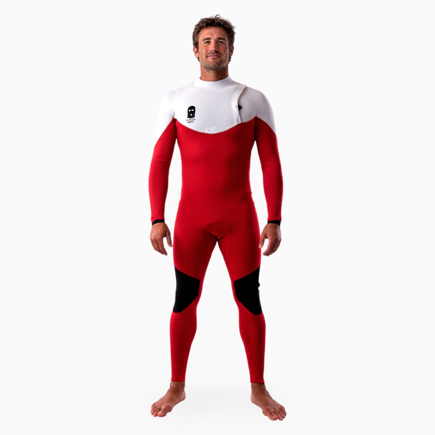 Surfer wearing a JANGA BASTARD red and white wetsuit on a white background 