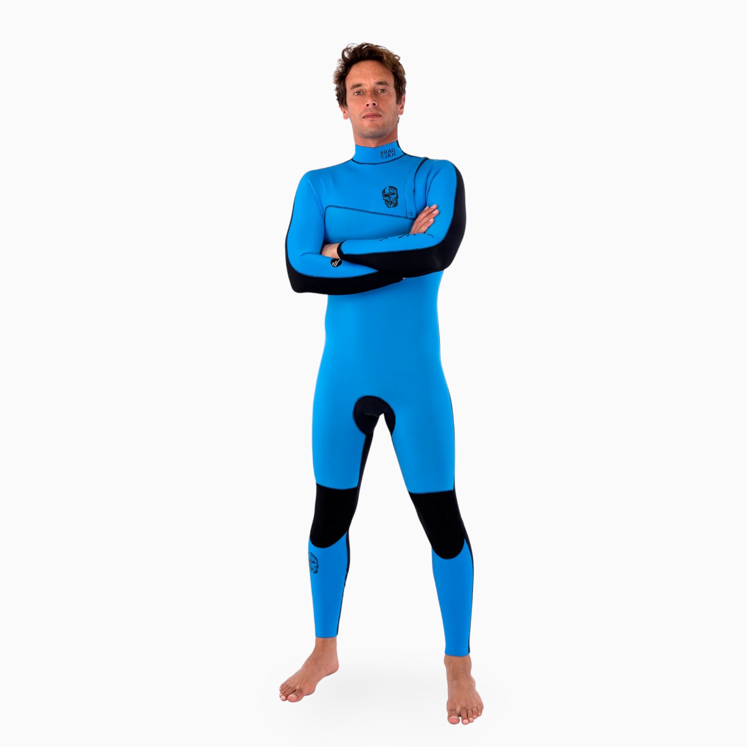 Surfer  wearing a JANGA DARK HALF blue and navy wetsuit on a white background