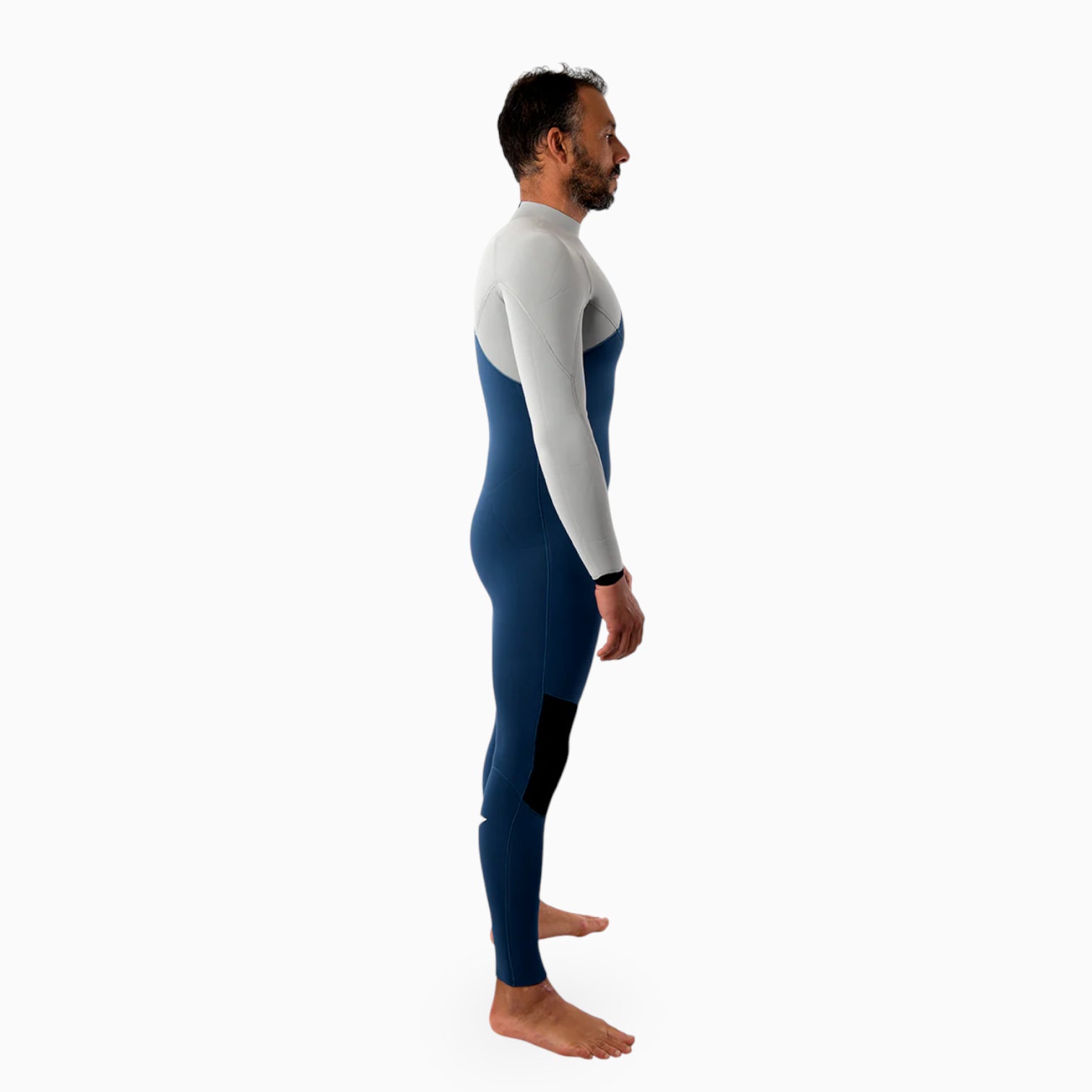 Surfer wearing a JANGA indigent blue and gray wetsuit on a white background