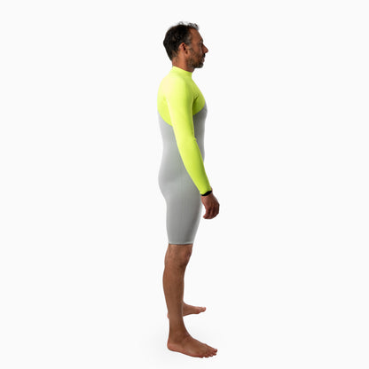 Surfer wearing a JANGA INDIGENT long sleeved spring gray and neon yellow wetsuit on a white background