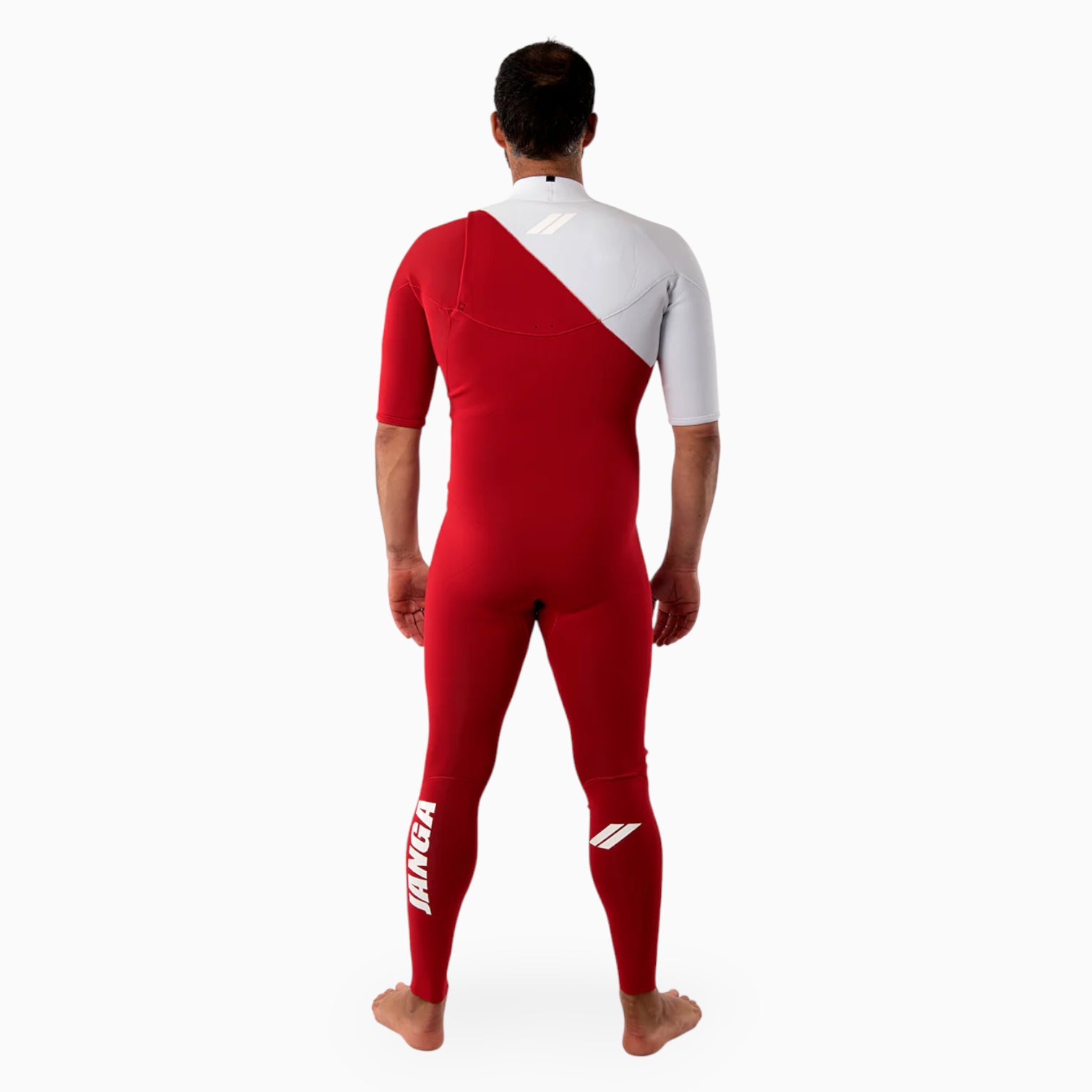 Surfer wearing a red and white JANGA Indigent wetsuit on a white background