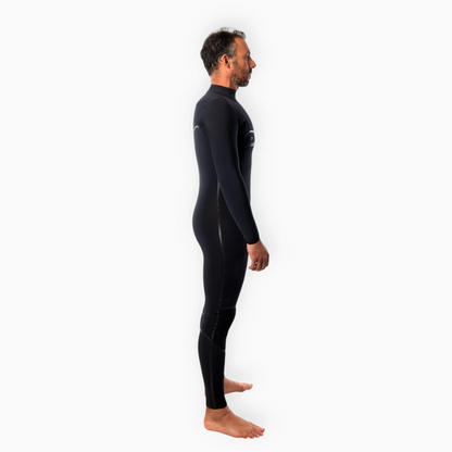 Male surfer wearing JANGA black wetsuit - Chosen Ring of Fire - side view
