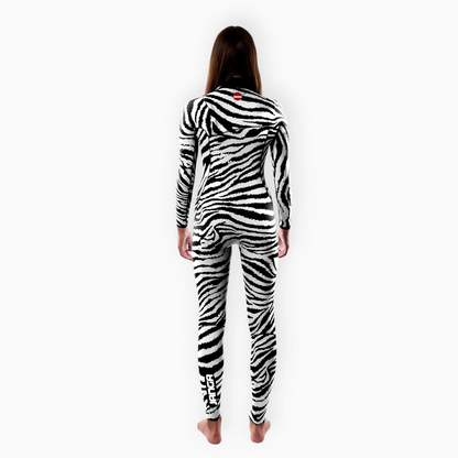 Surfer in Women's JANGA JANGLE ZEBRA wetsuit - back view