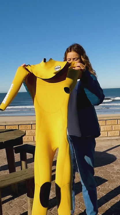 Mariana Silva @mariana_silva wearing JANGA PRO yellow wetsuit for bodyboarding session