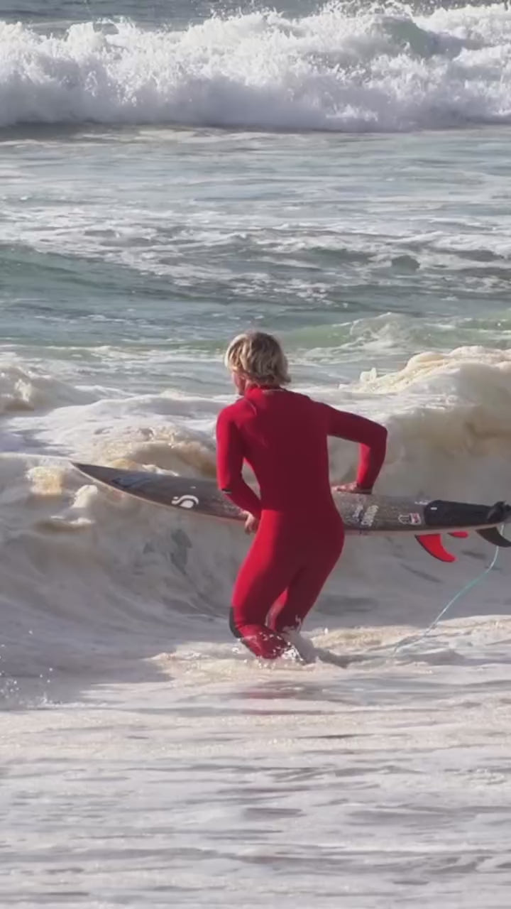 Surfer London Almida @londonalmida wearing JANGA PRO Men red wetsuit